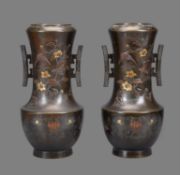A Pair of Japanese Bronze Vases each with a rounded body on a slightly splayed foot