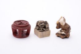 A Tsuishu Lacquer Netsuke in the form of a four-legged circular table