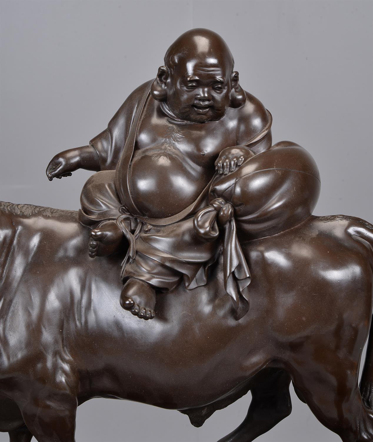 A Large Japanese Bronze Group of Hotei seated on the back of an ox - Image 2 of 4