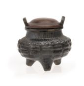 An unusual Chinese black lustred tripod censer