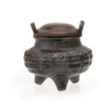 An unusual Chinese black lustred tripod censer