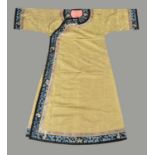 A Chinese lemon yellow silk damask Manchu Court lady's informal robe
