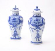 A pair of Chinese 'Shipwreck' blue and white vases and covers