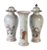 A group of three famille rose 'Eighteen Monks' vases from a garniture