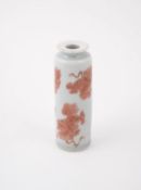 A small Chinese iron-red decorated celadon ground cylindrical vase