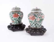 A pair of Chinese 'Famille Verte' vases and covers