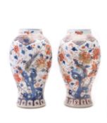 A pair of Chinese Imari slender baluster vases