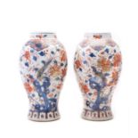 A pair of Chinese Imari slender baluster vases