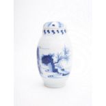 A Chinese blue and white transitional-style ovoid vase and cover