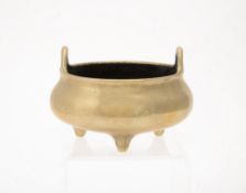 A Chinese bronze tripod censer