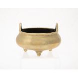 A Chinese bronze tripod censer