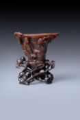 Y A rare Chinese rhinoceros horn 'Scholar' libation cup