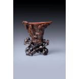 Y A rare Chinese rhinoceros horn 'Scholar' libation cup