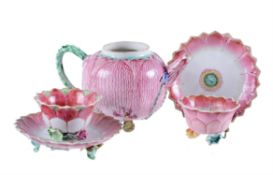 A pair of Chinese Famille Rose 'Lotus' tea bowls and saucers
