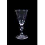 A heavy baluster wine glass