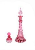 An English clear and ruby cased cut glass scent bottle and stopper