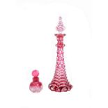 An English clear and ruby cased cut glass scent bottle and stopper