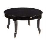 An ebonised mahogany metamorphic dining table