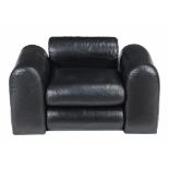 A black leather upholstered lounge armchair