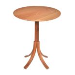 A walnut occasional table by Holgate and Pack
