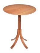 A walnut occasional table by Holgate and Pack