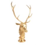 A gold coloured antler and composition model of a stag's head by Anthony Redmile