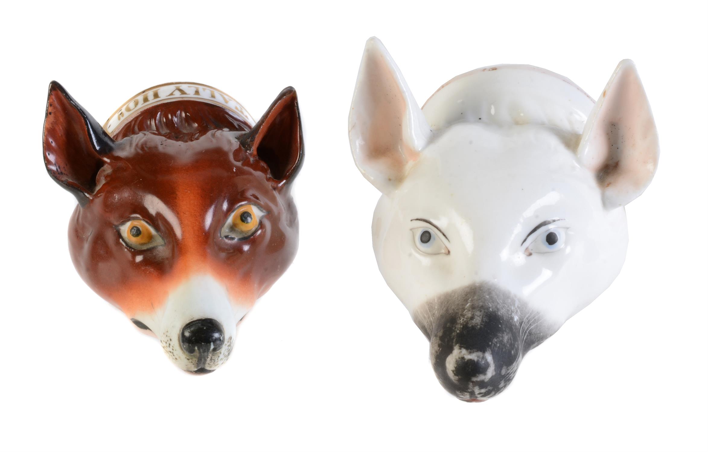 Two Staffordshire bone china fox mask stirrup cups