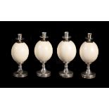 Four ostrich egg and nickel plated candle holders by Anthony Redmile