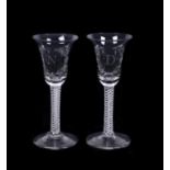 A pair of engraved Low Countries commemorative mixed twist wine glasses