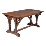 A Victorian Gothic Revival carved oak dining table