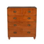 An Irish Victorian teak and brass bound campaign chest of drawers