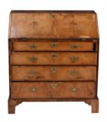 A George II walnut and feather banded bureau