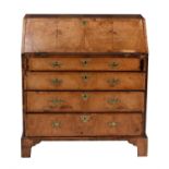 A George II walnut and feather banded bureau