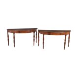 A pair of mahogany side tables