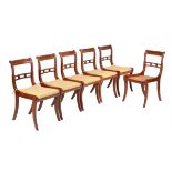 A set of six goncalo alves dining chairs in Regency style