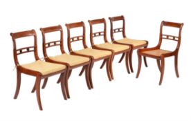 A set of six goncalo alves dining chairs in Regency style