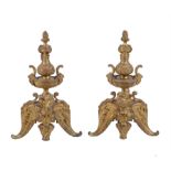 A pair of French gilt bronze chenets in Regence style