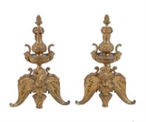 A pair of French gilt bronze chenets in Regence style