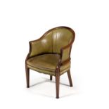 A late George III mahogany and green leather upholstered tub armchair