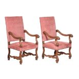 A pair of French carved walnut armchairs
