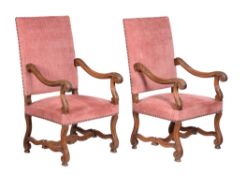 A pair of French carved walnut armchairs