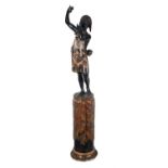 An ebonised and painted wood and composition model of a blackamoor