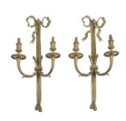 A pair of gilt metal twin light wall appliques in Louis XVI style