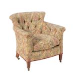 An Edwardian walnut and upholstered tub armchair in the manner of Howard & Sons