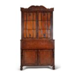 A George IV mahogany and goncalo alves bureau bookcase, circa 1825