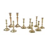 Five various pairs of cast brass candlesticks