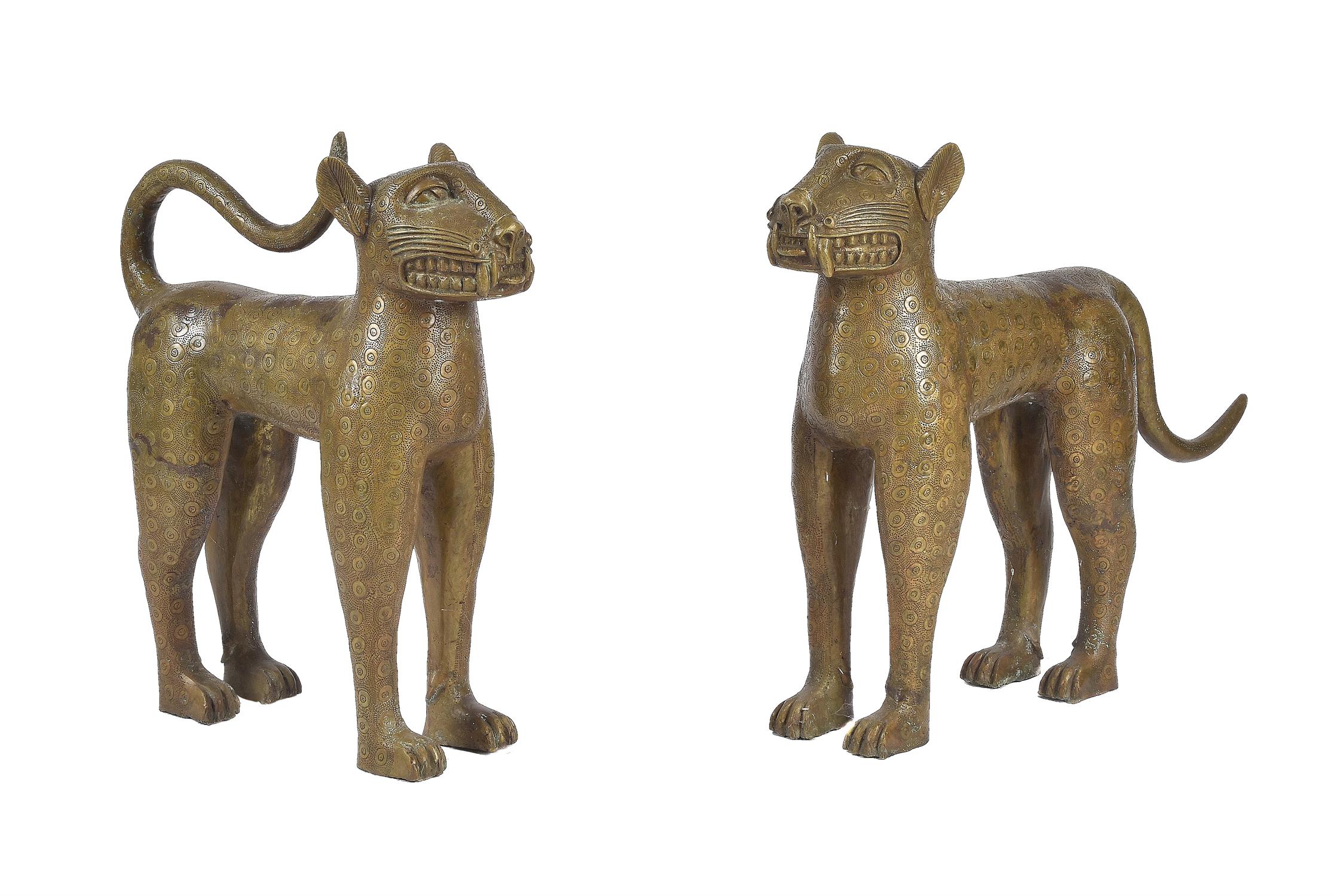 A pair of gold painted metal models of leopards in the style of Benin bronzes