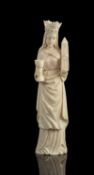 A French carved ivory model of a female saint in 14th century style