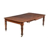 A Victorian mahogany extending dining table
