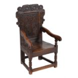 An oak panel back armchair